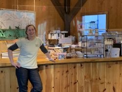 April Lemay in front of her cafe desk